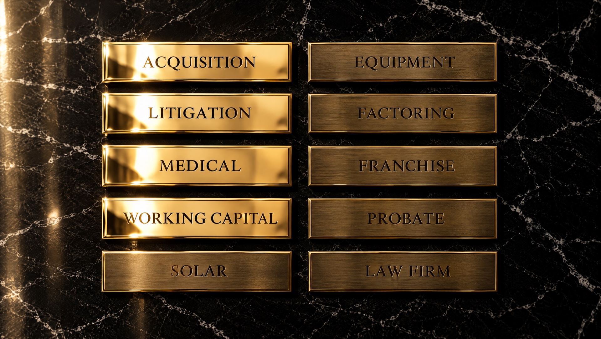 Ten engraved gold plaques on a black marble wall, four polished bright.